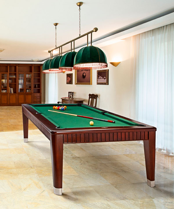 wooded pool table with green felt